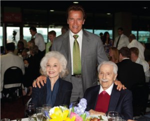 Joe and Betty Weider, pictured above with Arnold Schwarzenegger, donated a painting from their personal collection.