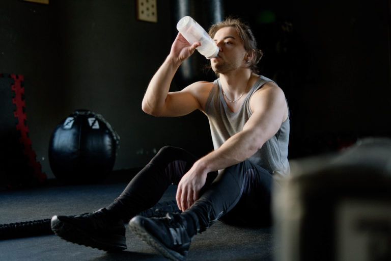 A person drinking water after a workout.