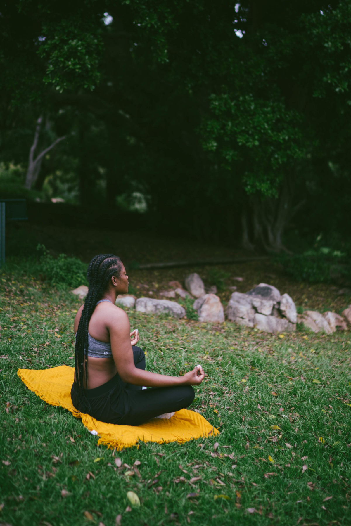 A woman meditating in nature.