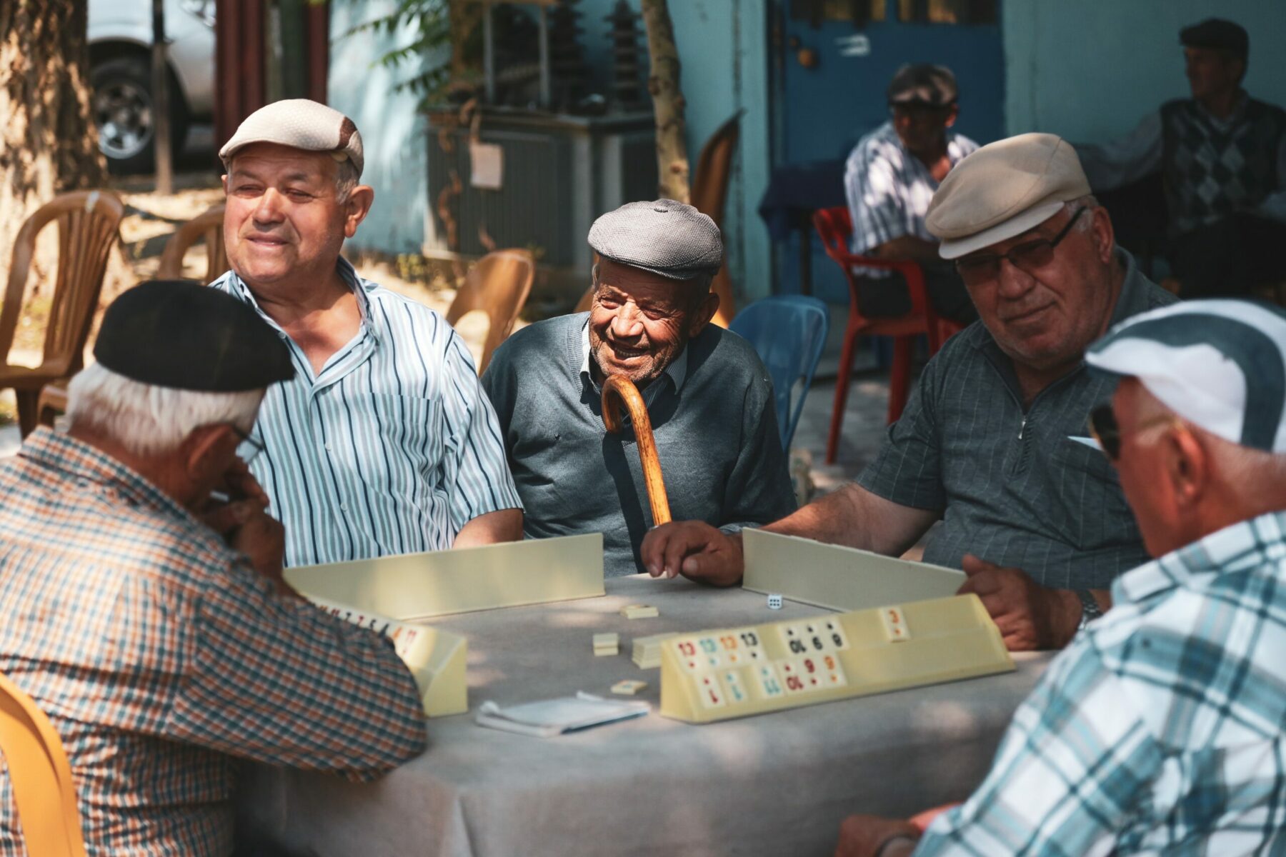 Group of elderly mean playing a game.