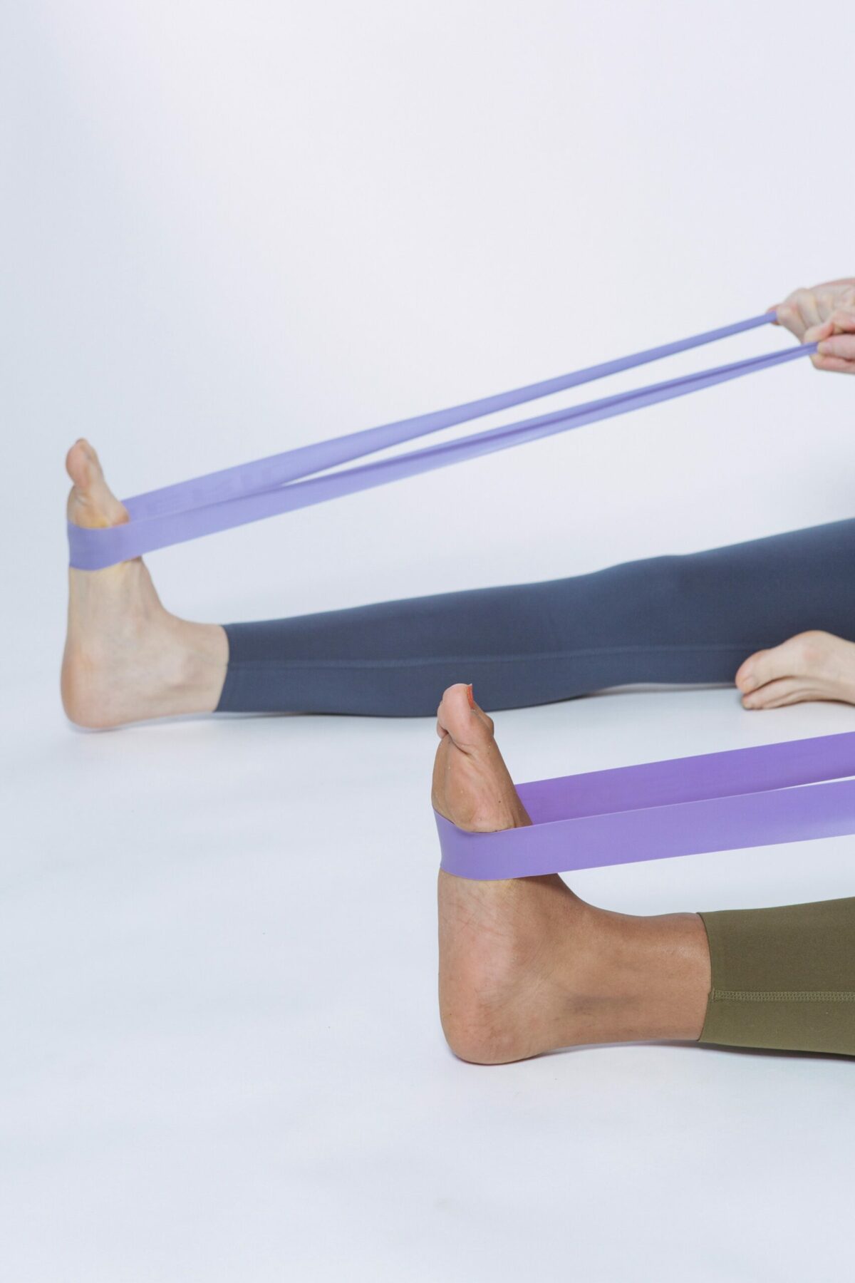 Two people using exercise bands.