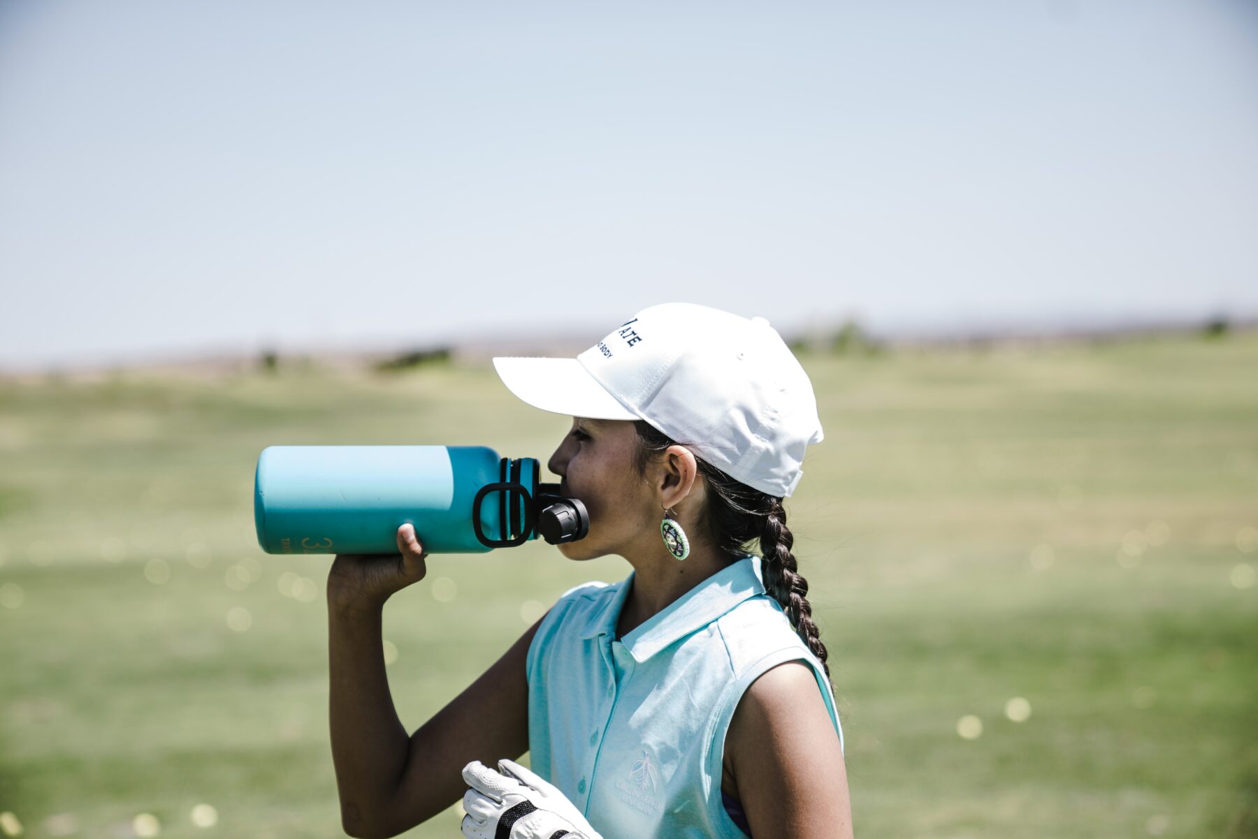 Golfer drinking water.