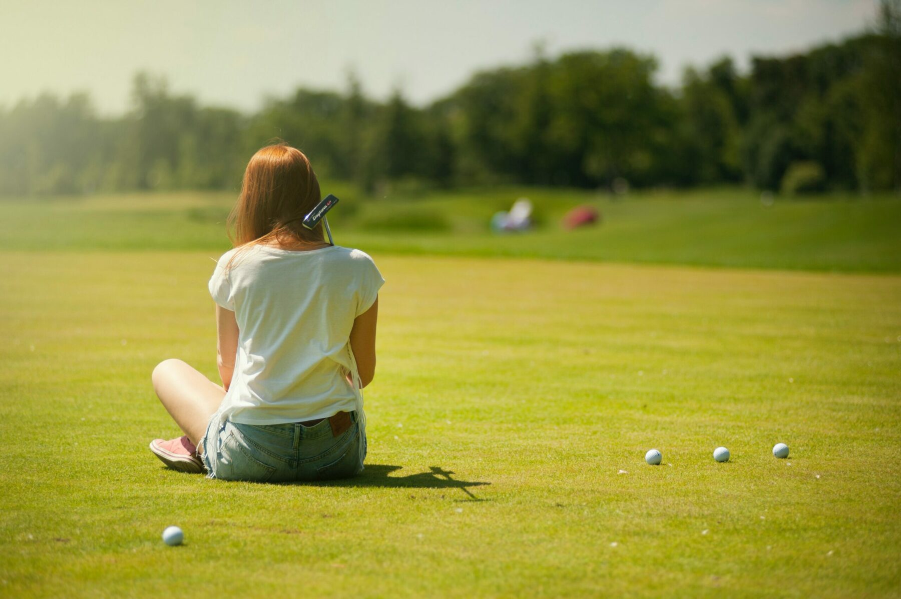 Golfer sitting.