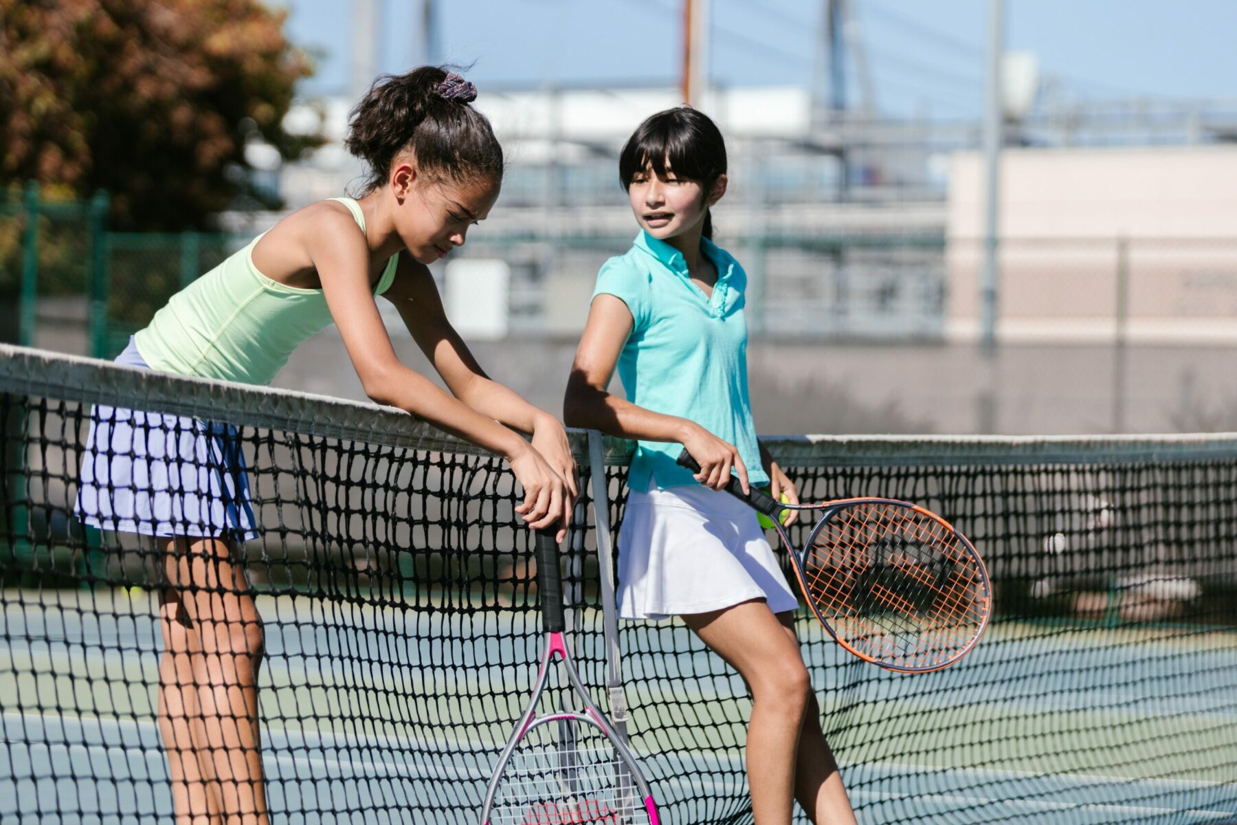 Girls playing tennis.