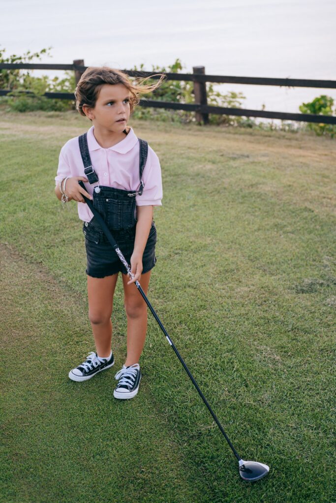 Girl playing golf.