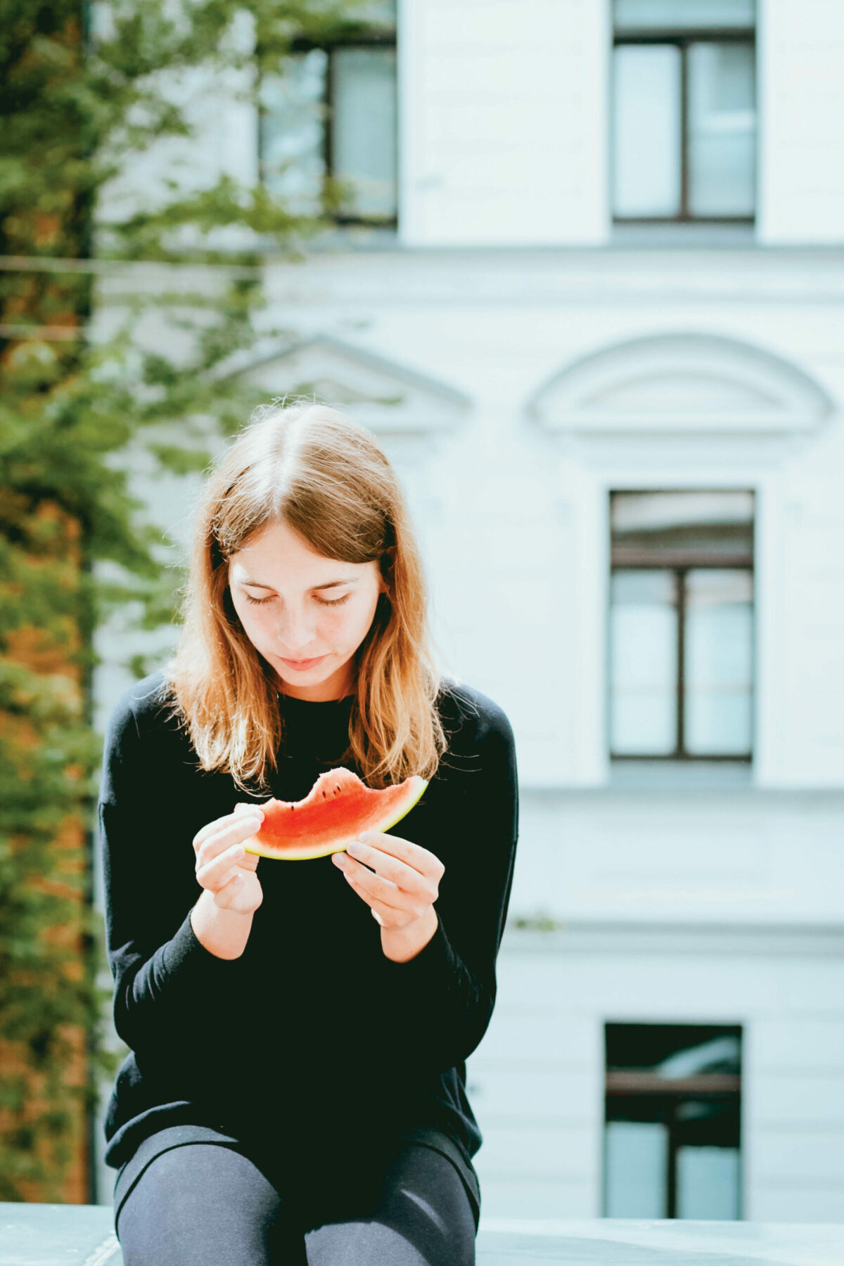 Woman eating a watermelon.