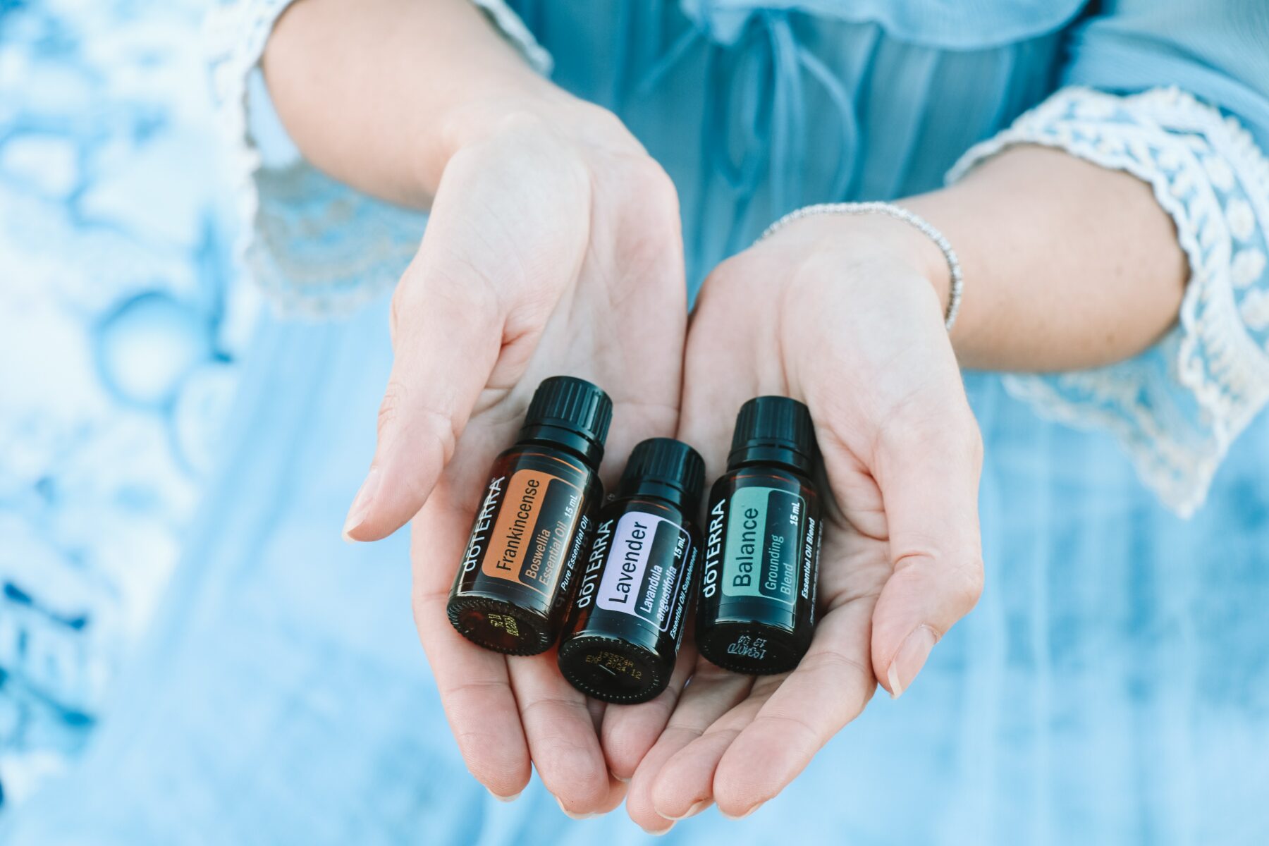 Essential oils in hand.