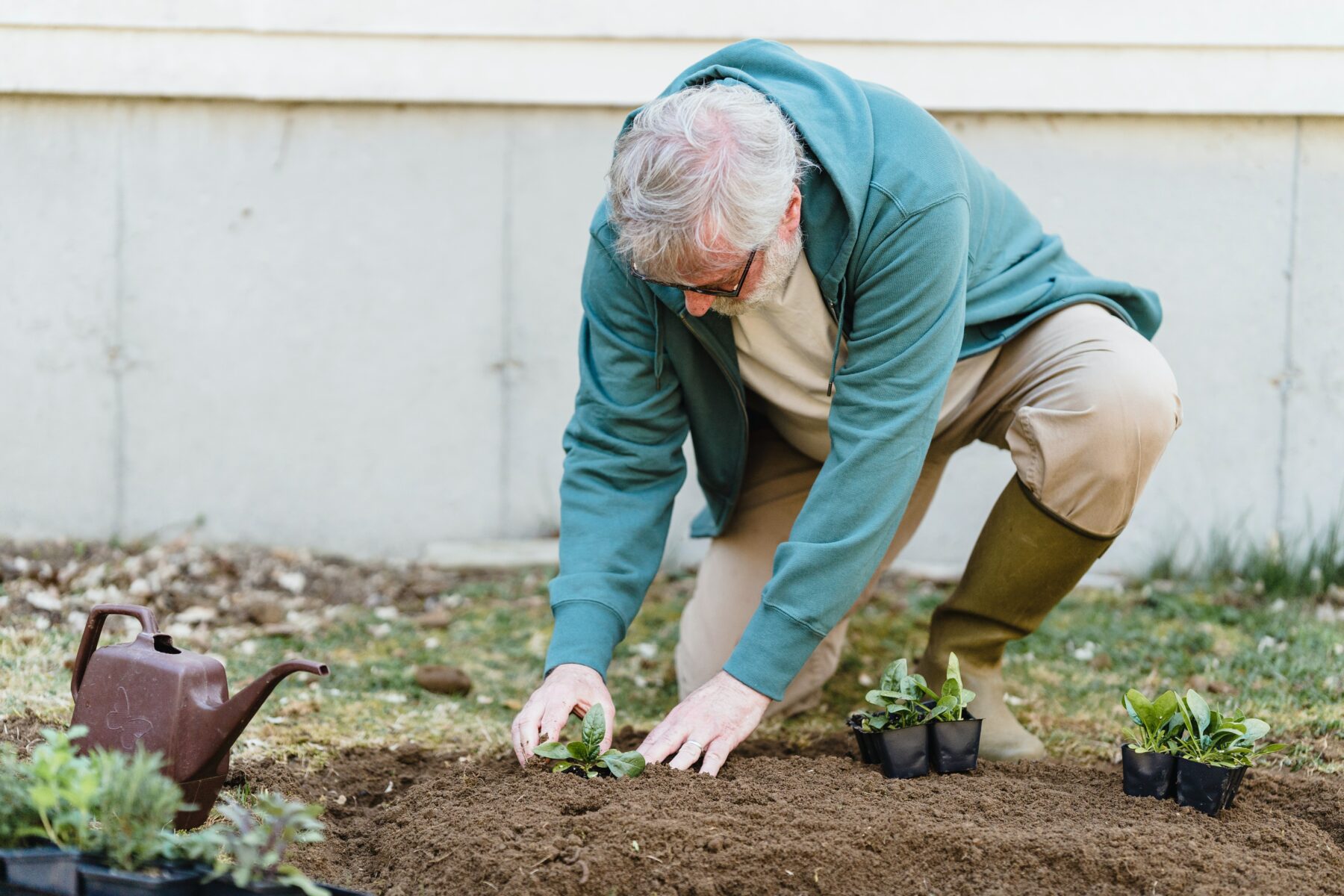 Older man gardening.