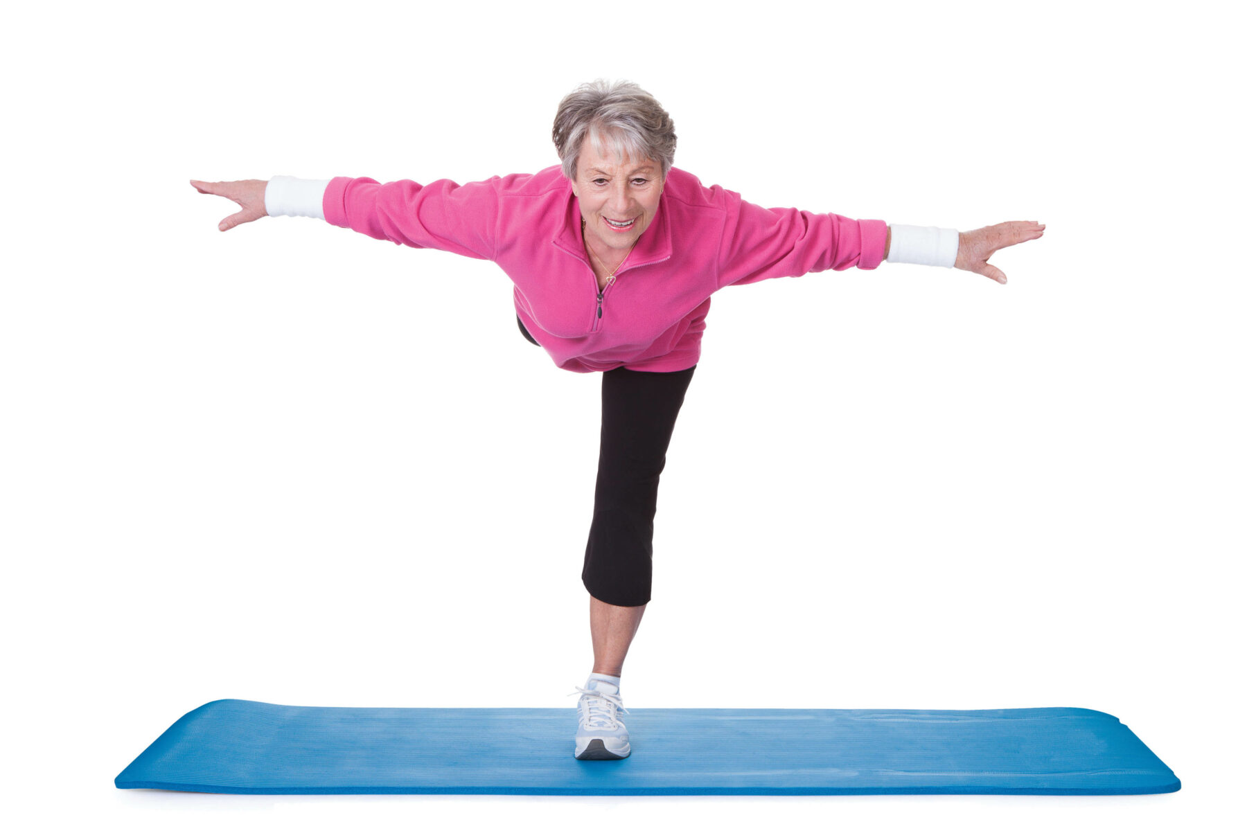 Senior Woman Standing On One Leg And Exercising.